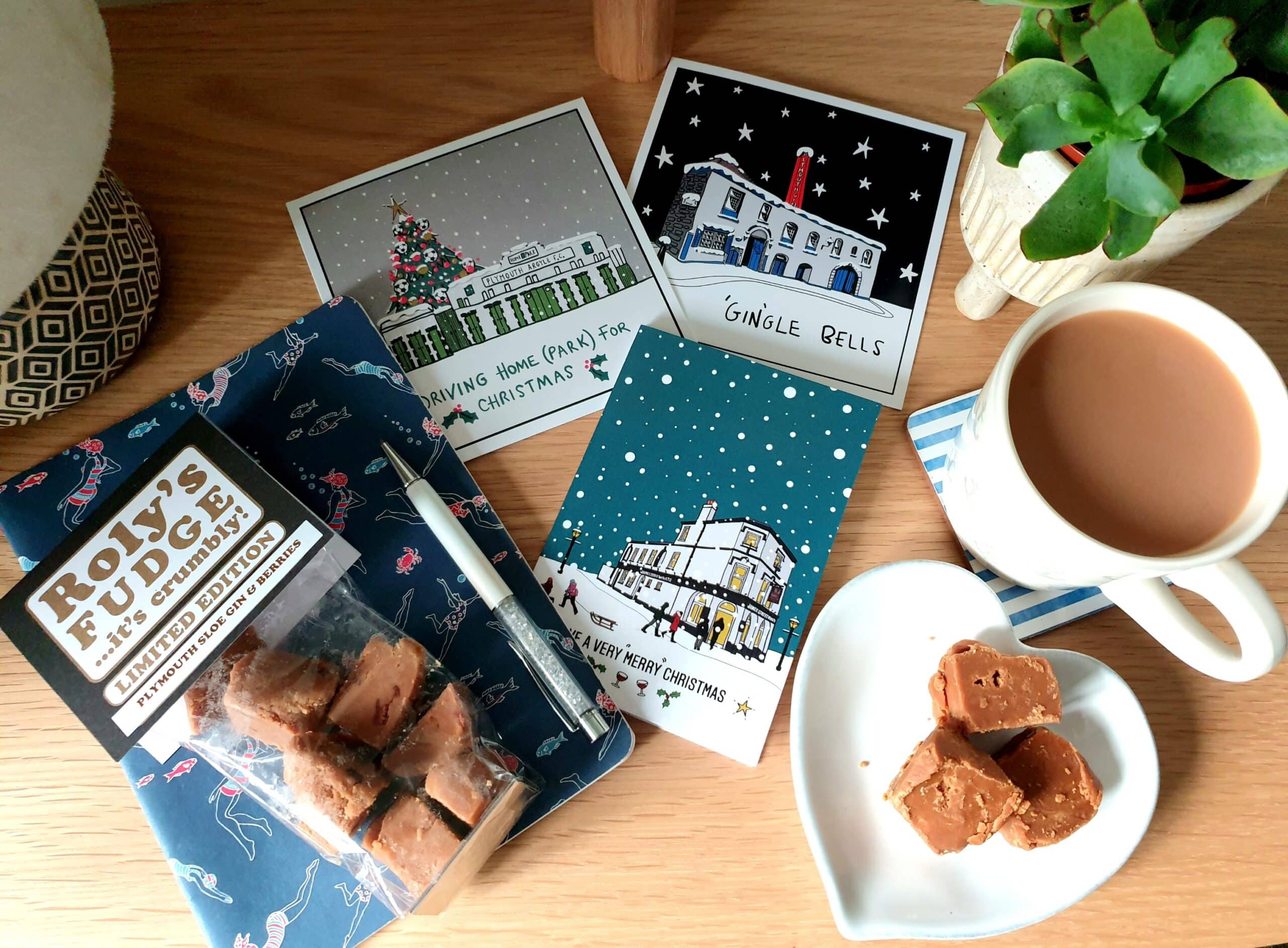Christmas cards, Roly's fudge and a cup of tea on a table