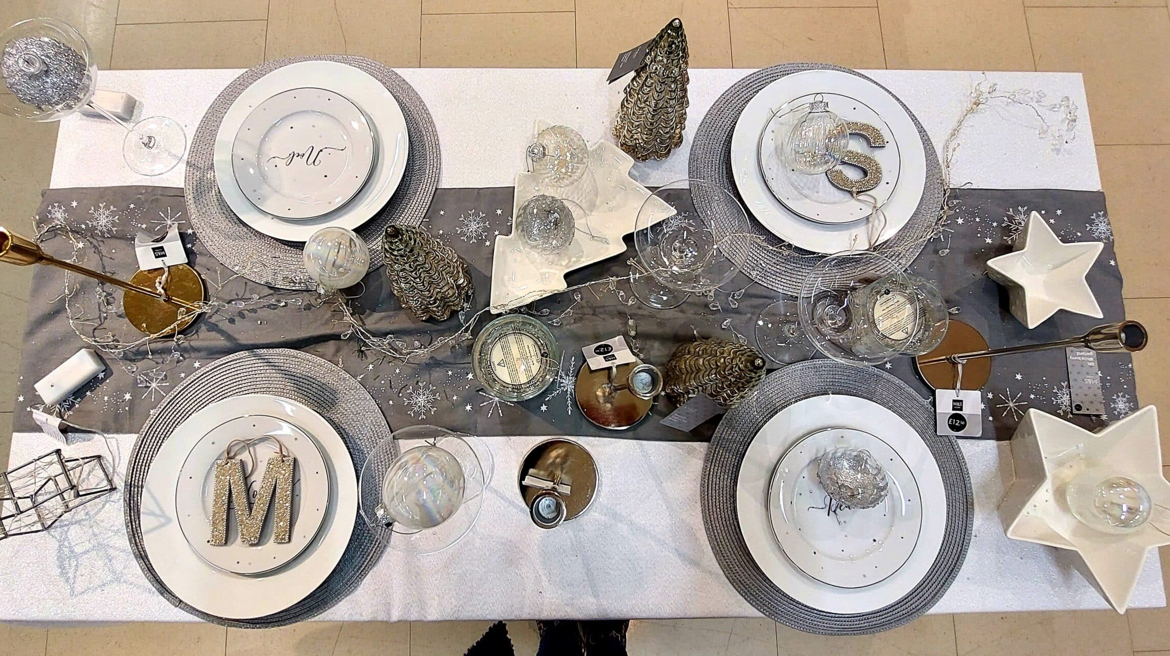 Add some snowflake sparkle to your Christmas table with crockery, candles and linen from Marks and Spencer